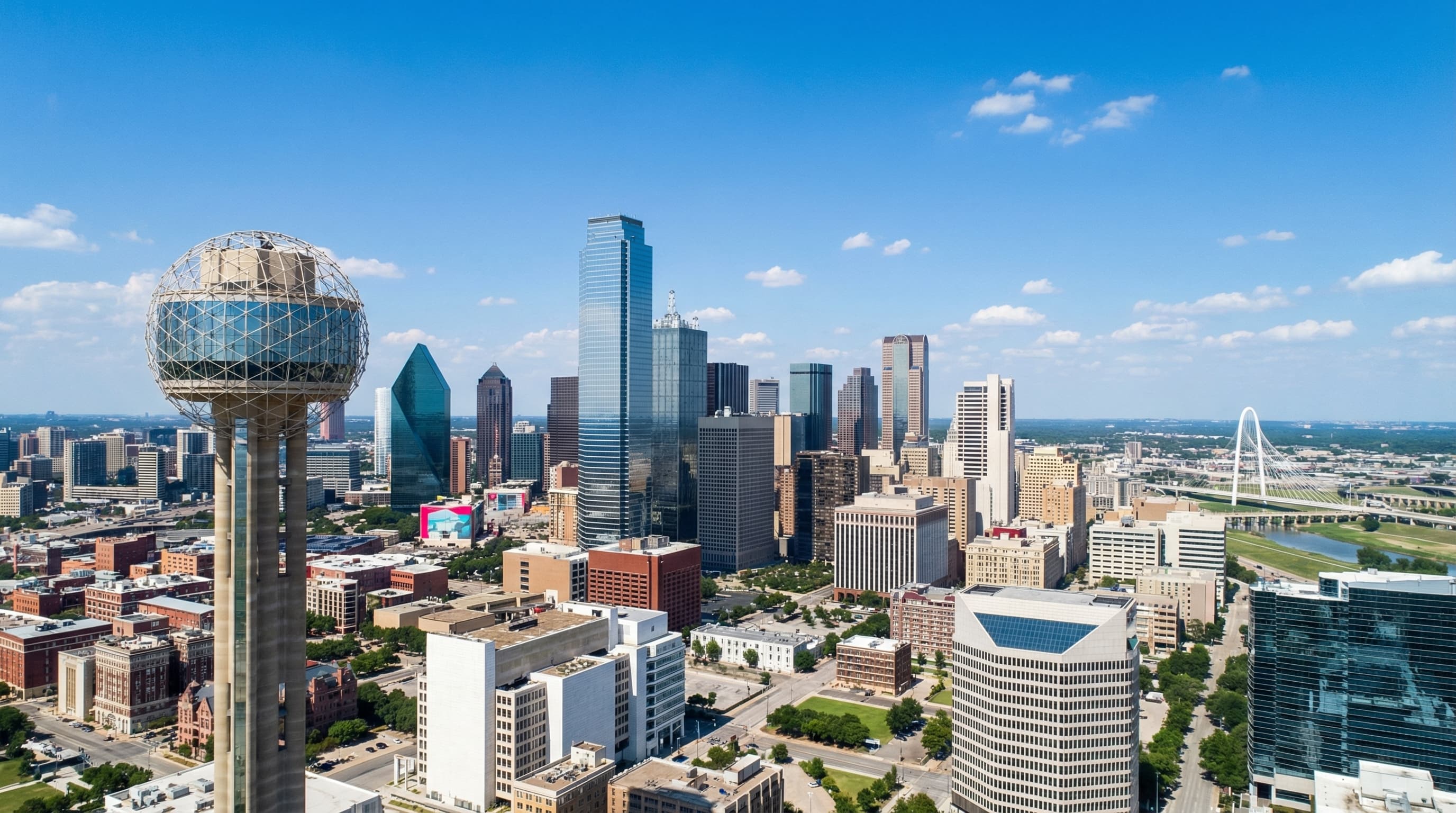 Aerial view of Dallas Texas skyline with downtown skyscrapers, Arts District, and sprawling suburbs at sunset