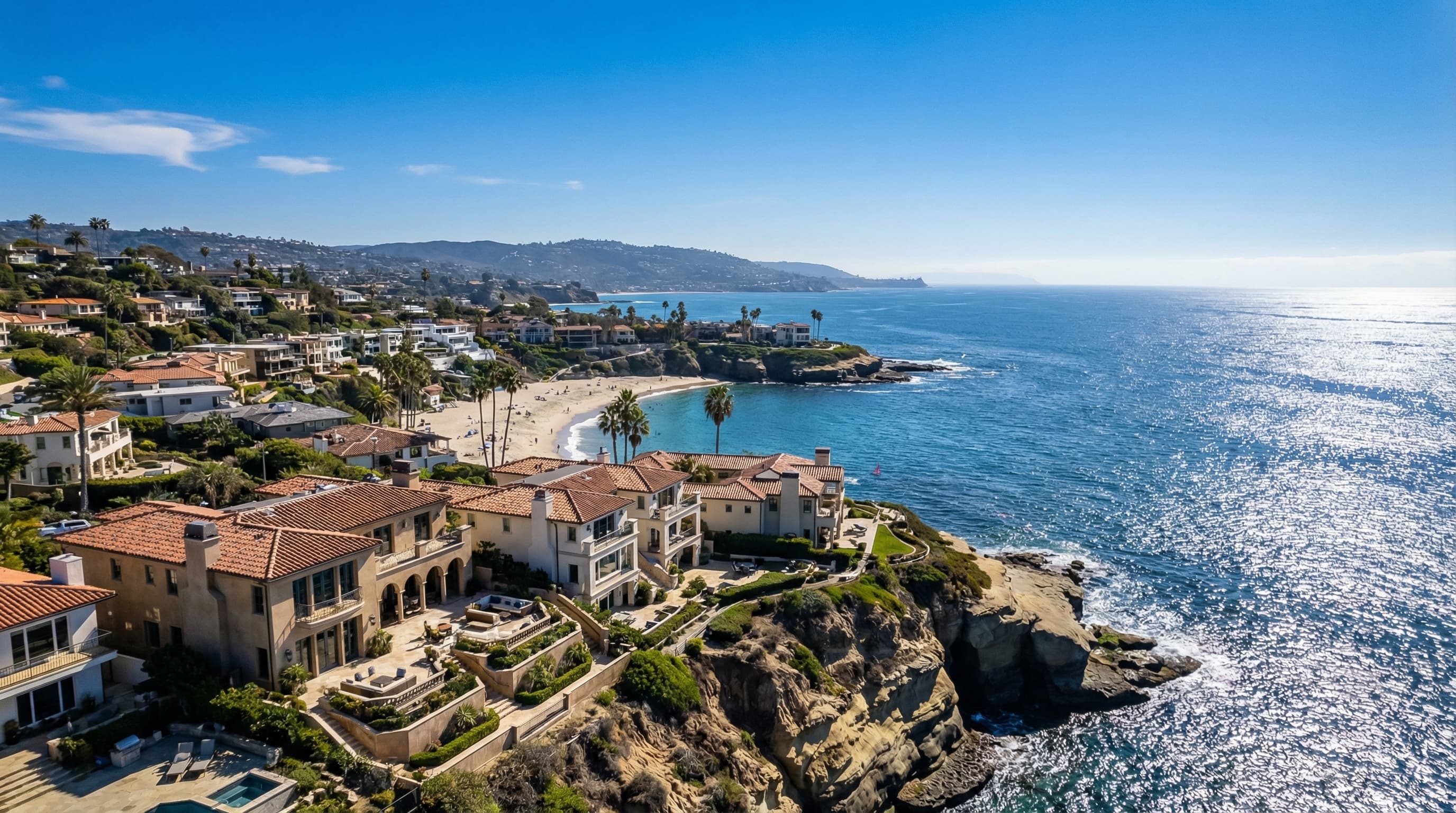 Prestigious La Jolla California coastal village with elegant Mediterranean-style homes perched on cliffs overlooking La Jolla Cove and Pacific Ocean azure waters