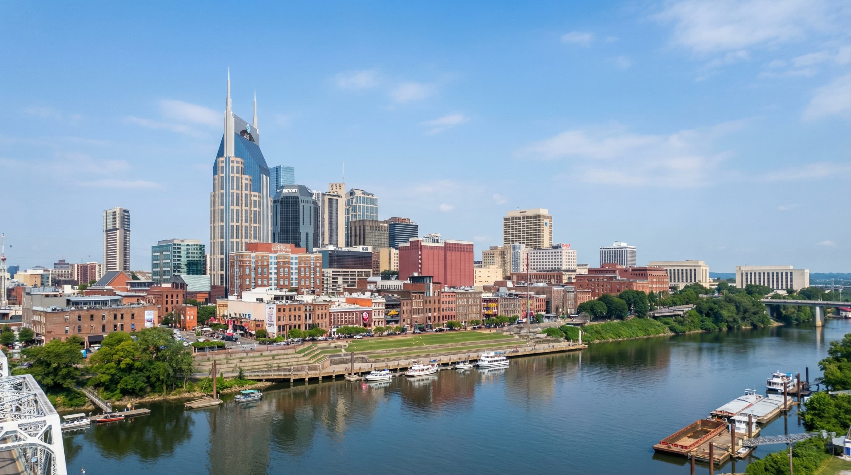 Aerial view of Nashville Tennessee metro area with downtown skyline, Cumberland River, and surrounding hills