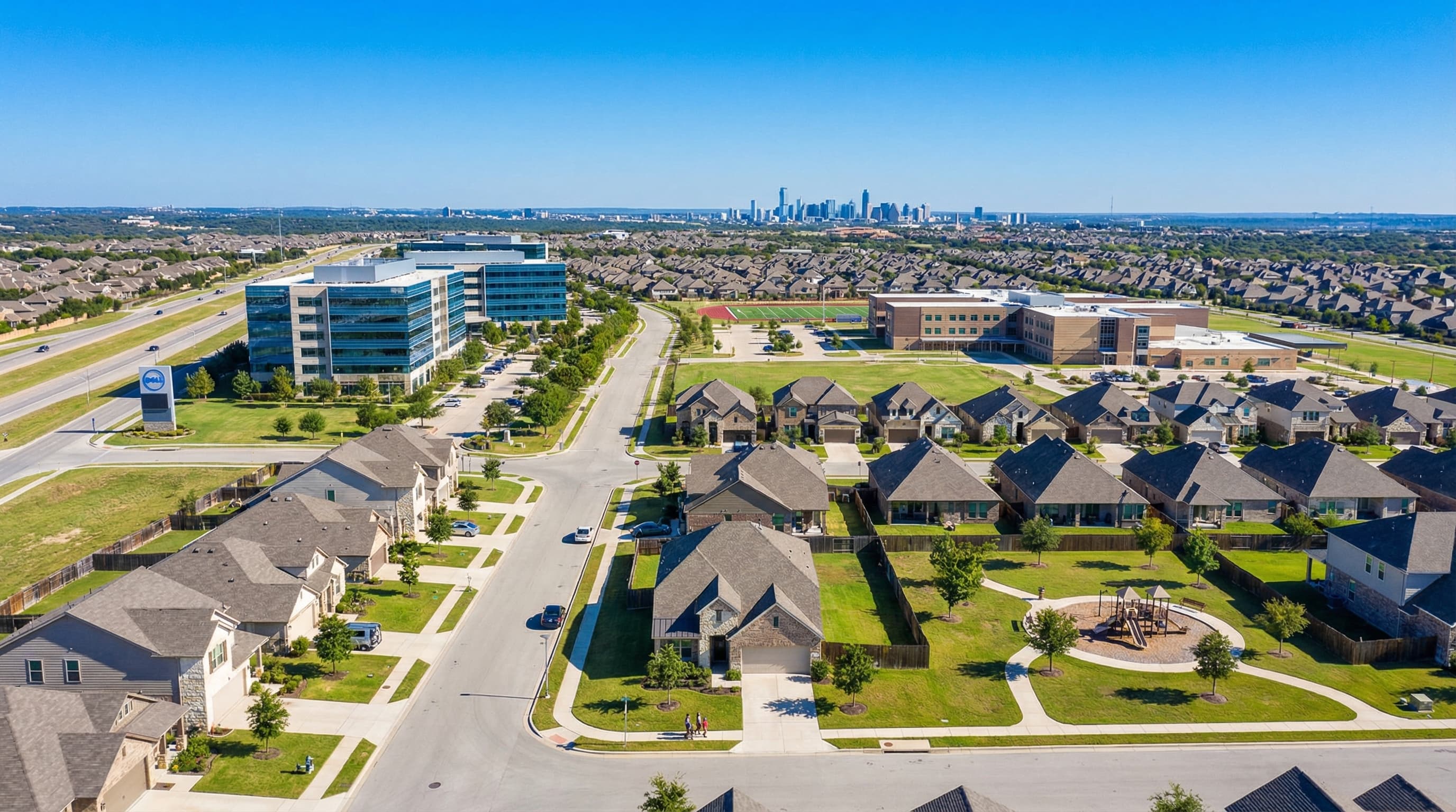Round Rock Texas suburban homes with Dell Diamond stadium and Texas Hill Country backdrop
